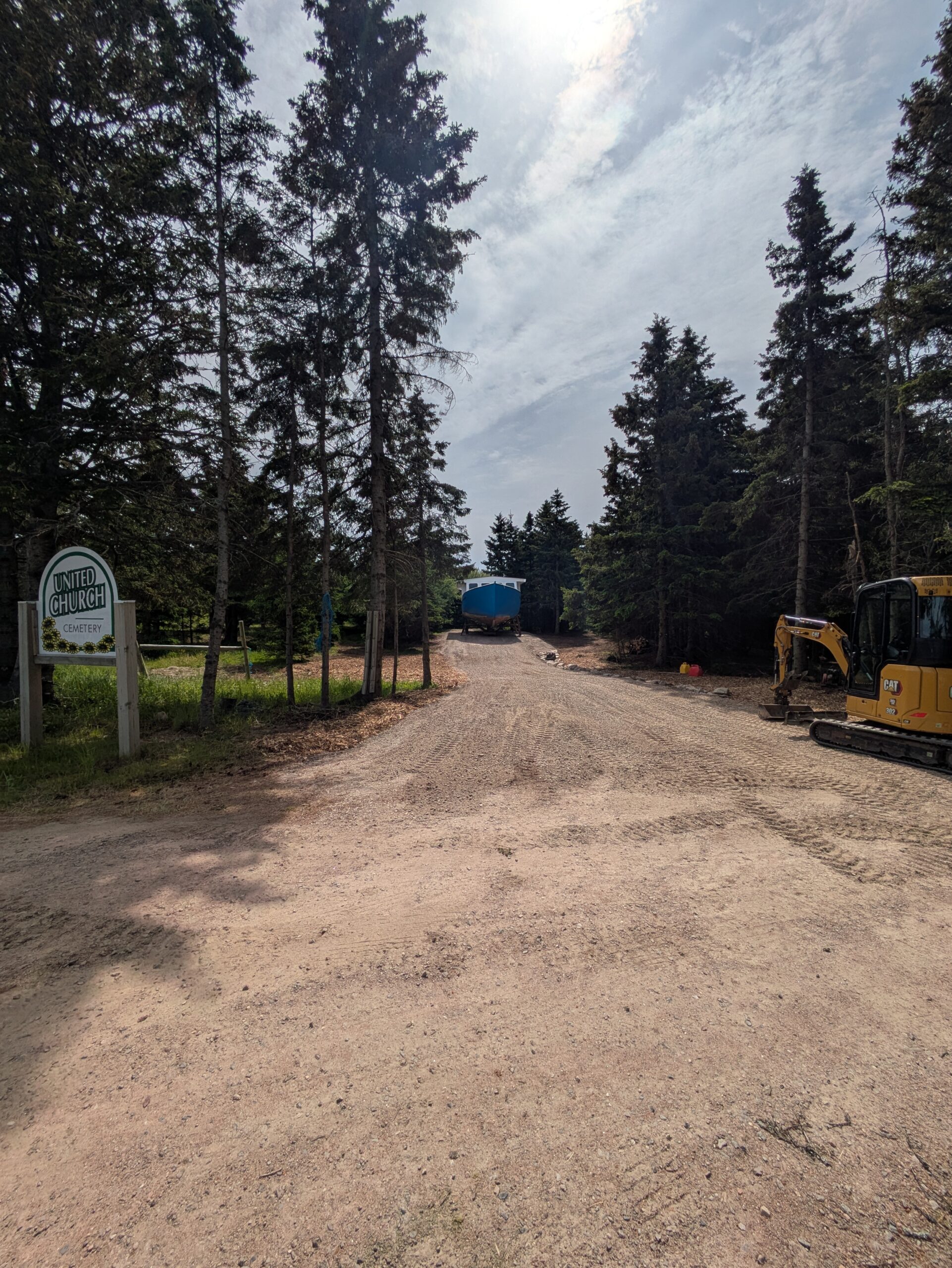 Active driveway and drainage work on a rural property