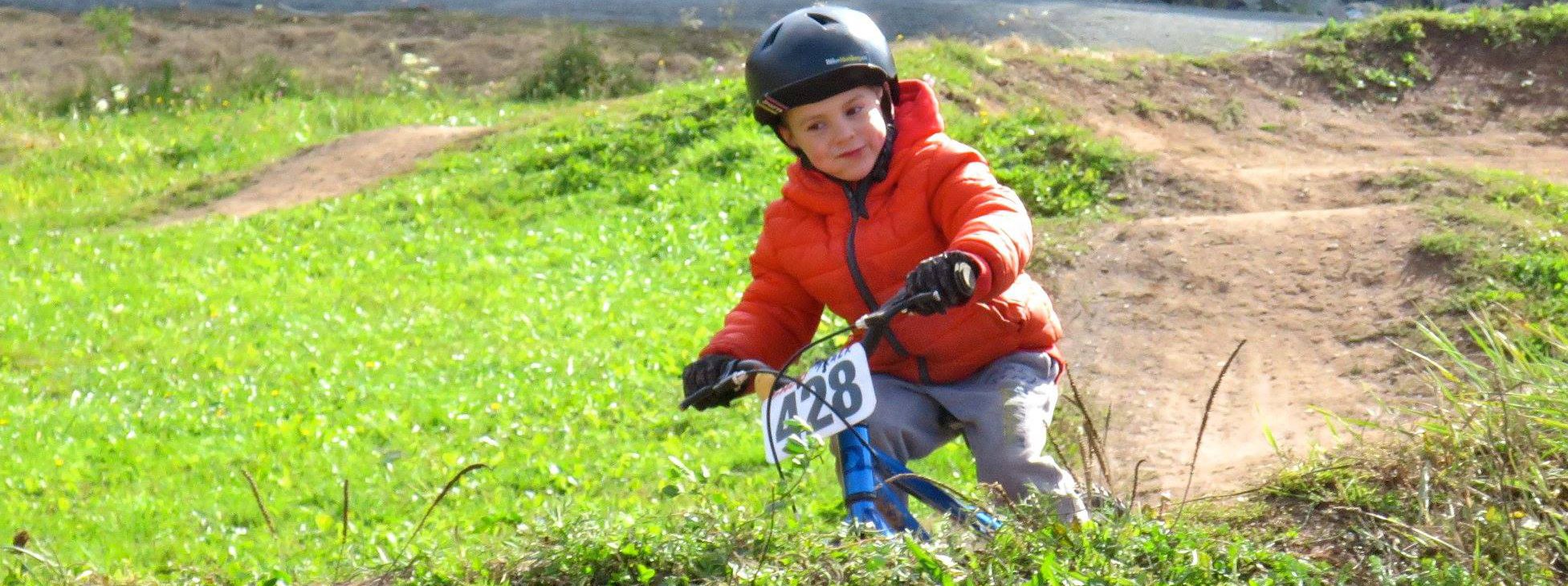 Youth rider on the pump track at Keppoch Mountain