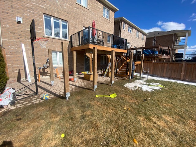 Vendor-supplied example of a raised backyard deck supported on helical piles